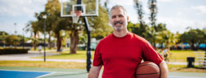 man in red with basketball